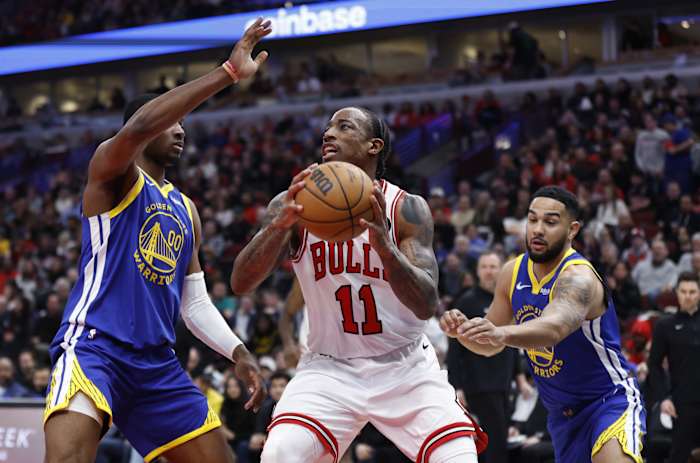 Chicago Bulls forward DeMar DeRozan (11) drives against Golden State Warriors forward Jonathan Kuminga (00) during the second half at United Center.